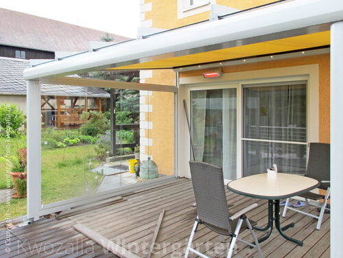 Terrassendach - Wetterseite mit Schiebeverglasung ausgestattet + Sonnenschutz + LED Beleuchtung + Heizung